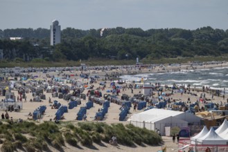 A lively sandy beach with lots of people and beach chairs, Düne, Warnemünde, Rostock,