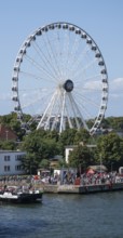 Large Ferris wheel on the waterfront promenade, Warnemünde, Rostock, Mecklenburg-Vorpommern,