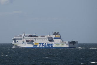 LNG-powered TT-Line ferry travelling across a gently moving blue sea, near Warnemünde, Rostock,