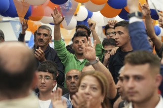 Gaziantep, Türkiye – May 28, 2023. Turkish citizens wave flags of Türkiye and the ruling Justice