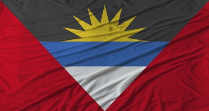 Antiguan flag waving. Flag of Antigua and Barbuda with cloth texture