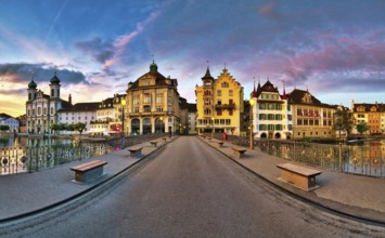 View of Lucerne's old town with Jesuit church from the Reuss bridge at dawn, Canton of Lucerne,