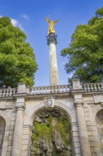 A magnificent golden statue on a column above a staircase, Munich, Germany