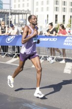 Guye Adola (ETH), later in 4th place, at KM38 in front of Potsdamer Platz at the 51st BMW Berlin