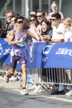 Yuhei Urano (JPN), later in 5th place, at KM38 in front of Potsdamer Platz at the 51st BMW Berlin