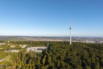 Stuttgart television tower stands above a forest with a sweeping city view in the background, Gazi