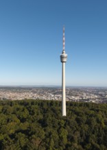 View of a television tower above a forest with a cityscape behind it, Stuttgart, Baden-Württemberg,
