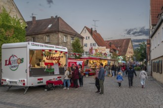 Show shops in the evening at the parish fair in the village of Eschenau, Middle Franconia, Bavaria,