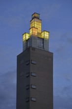 Albinmüller Tower built in 1927 by architect Albin Müller, spire with illumination during twilight,