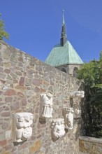 Sculptures of Magdeburg originals on the city wall and the Gothic Magdalen Chapel, Magdeburg,