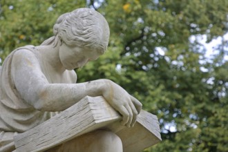 Seated white female figure reading a thick book as a symbol of science, allegory, knowledge,
