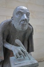 Albertus Magnus by Heinrich Apel 1985, medieval scholar and bishop writing with quill, bronze