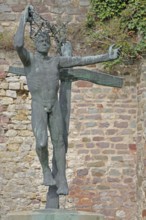 Sculpture Resurrection by Fritz Cremer 1947, naked standing male figure on the cross, death, life,