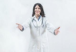 Doctor smiling with open arms welcoming. Friendly doctor hugging the camera. Medical friendship