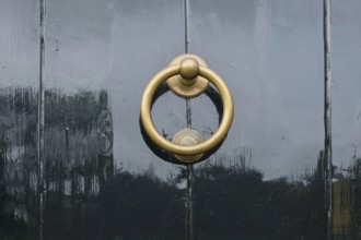 Door knocker on a black front door, Province of Groningen, Netherlands