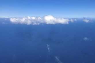 View from aeroplane on white bright cluster cloud Altocumulus cloud, international