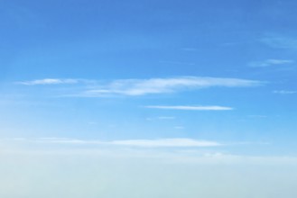 Altostratus clouds at an altitude of around six 6 kilometres under a blue sky, international