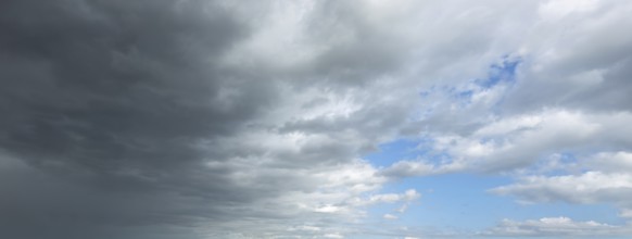 Panorama photo from left cold front clouds of cumulus clouds right in front altocumulus clouds and