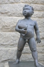 Putti at the town hall, bronze sculpture, naked figure with scroll, paper, entrance, town hall,