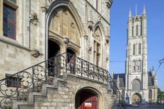 13th century Gothic St Bavo's Cathedral and entrance to the 14th century medieval belfry in the