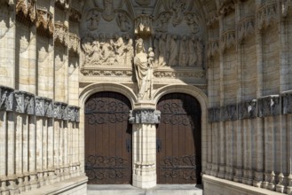 Portal of 14th century Onze-Lieve-Vrouw-ten-Poelkerk, Gothic church of Our Lady ten Poel in the