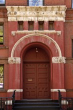 Historic school building with separate entrance for girls, New York City, USA