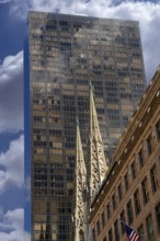 Towers of St Patrick's Cathedral in front of a skyscraper, Manhattan, New York City, USA