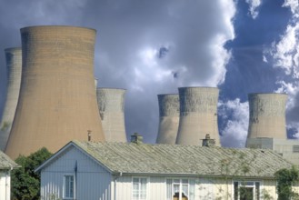 Cooling towers of a coal-fired power station next to a residential neighbourhood, Midlands,