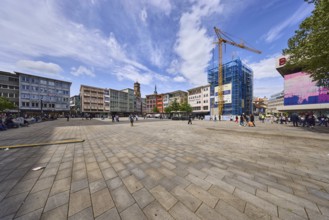 Square, general architecture, pavement slabs, construction site, scaffolding, crane, pedestrians as