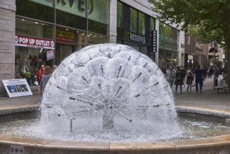 Dandelion fountain, frozen movement, water, stainless steel fountain, building, retail, shop