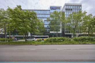 Auditing and management consultancy KPMG, modern architecture, street, public bus, trees, milky