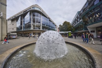 Dandelion fountain, stainless steel fountain, building, pedestrian zone, retail shops, shop window,