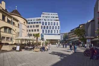 Market hall, historical building, shopping, outdoor area with tables, chairs and parasols,