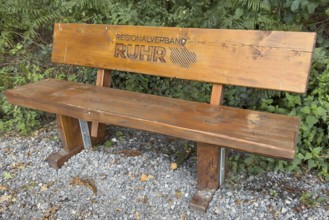 Wooden bench RVR bench with burnt-in lettering Regionalverband Ruhr in landscape conservation area