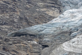 Majestic ice formations dominate the rocky terrain and show the beauty of a glacier in a secluded