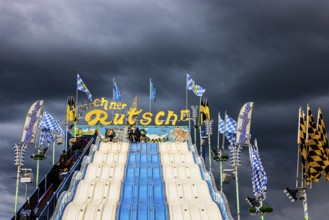 Dark clouds over the Oktoberfest attraction Münchner Rutschn, Festwiese, Theresienwiese,