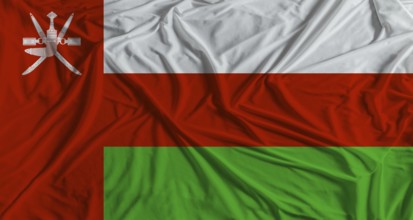 Omani flag with fabric texture background. National flag of Oman with cloth texture