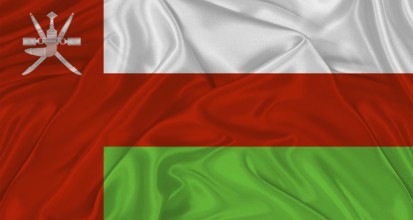 Flag of Oman with cloth texture. Close up of Oman flag waving