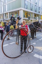 A penny-farthing rider with top hat, Oktoberfest, Munich, Upper Bavaria, Bavaria, Germany