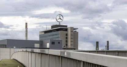 The Mercedes star rotates on a Mercedes Benz Group building in Untertürkheim. Stuttgart,