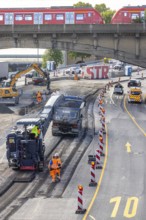 Surfacing work on the B10 federal road at the Leuze junction. A construction machine mills asphalt
