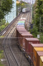 Two goods trains underway on the Schuster railway in front of the Münster cogeneration plant.