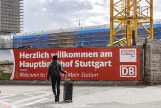 Welcome to Stuttgart Central Station. Banner at the entrance to the platforms. Rail travellers have