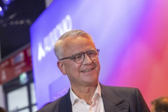 Philipp von Hirschheydt, CEO Aumovio. Exhibition stand of the company Aumovio. IAA MOBILITY in