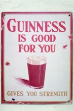 Old metal sign for Guinness beer, London, England, Great Britain
