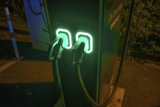 Evening-lit charging station for electric cars in a car park, Erlangen, Middle Franconia, Bavaria,