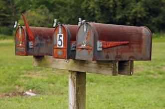 Rusted, private mailboxes at the front of the street, Walpack, New Jersey, USA