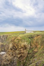 Chapelle Saint-They on the edge of a steep cliff a historical building on the dramatic french