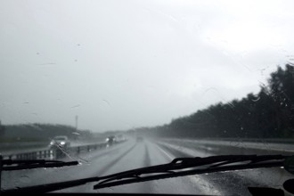 Car journey in rainy weather, summer, Germany
