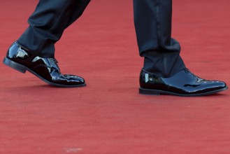 Venice, Italy - 2 September 2025: Tuxedo trousers and dinner jacket shoes during the red carpet of